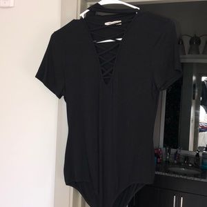 Black open front criss cross body suit